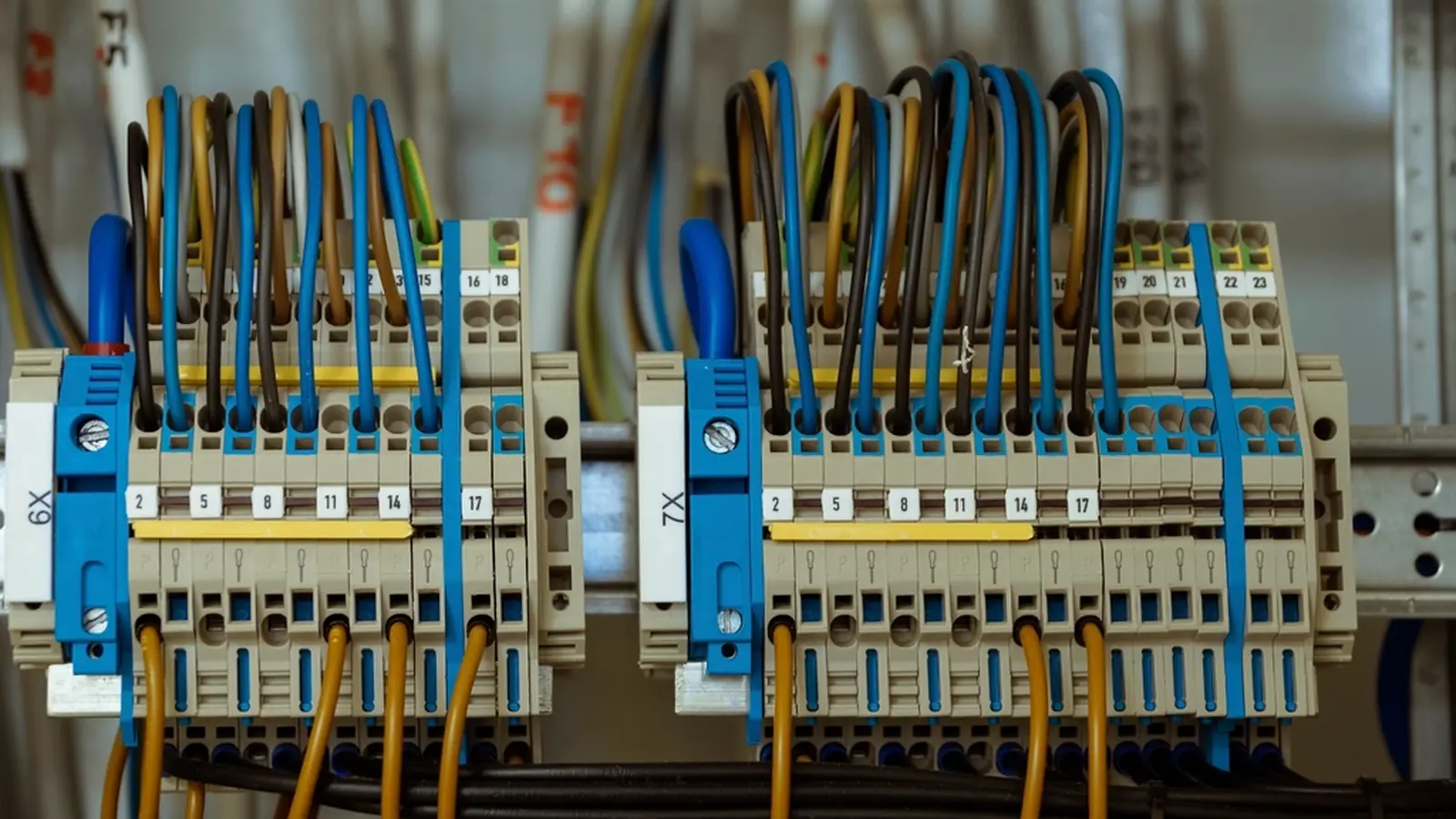Close-up of circuit breakers and terminal wiring inside an electrical distribution board